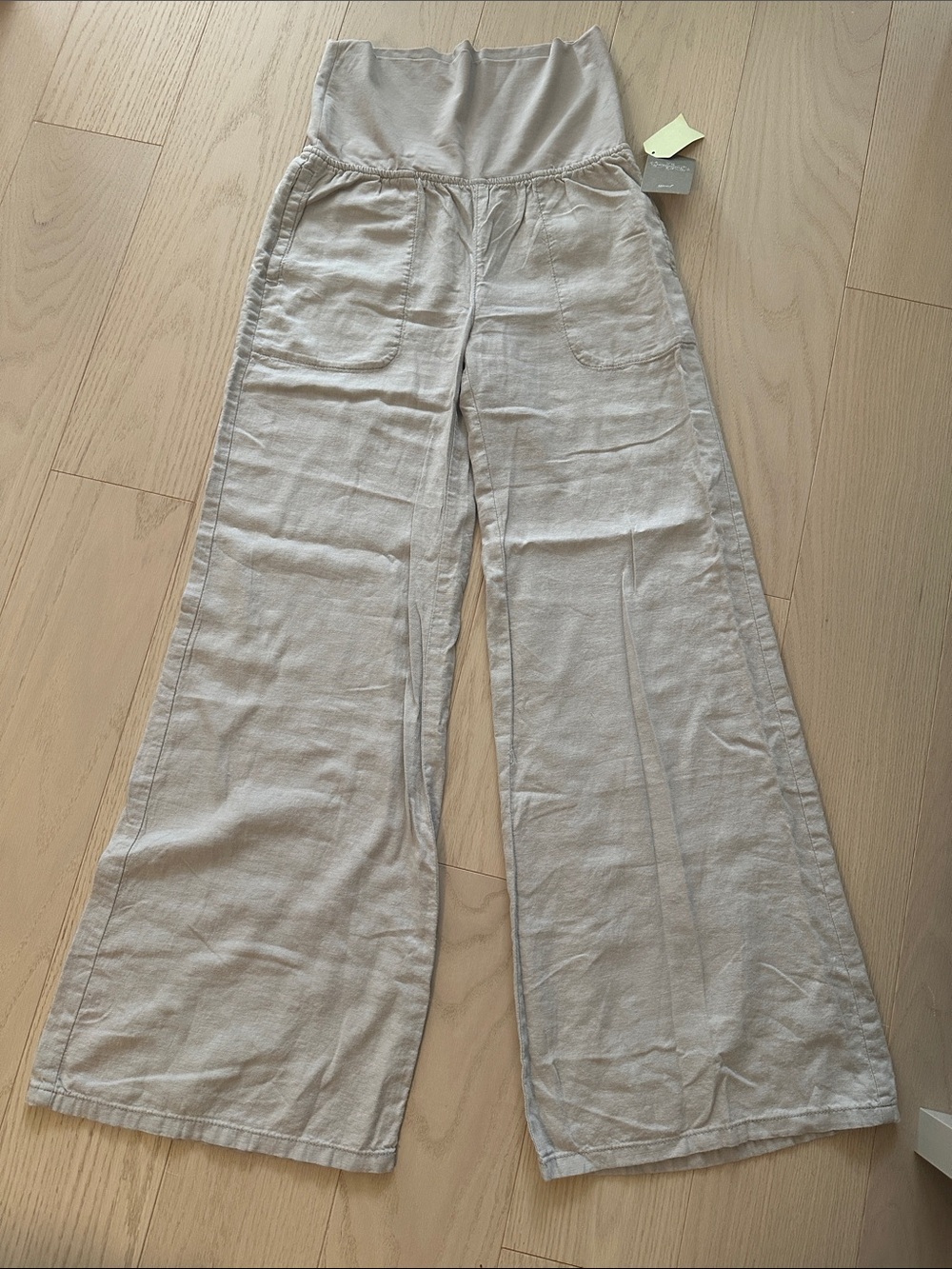 Anthropology Wide-Leg Pants with Fold-Over Waist in Light Gray.